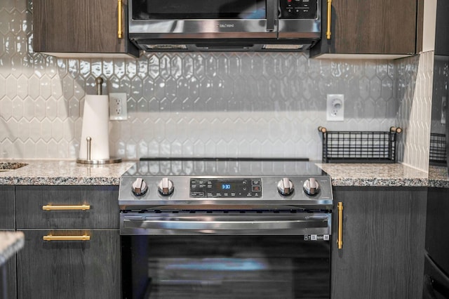 kitchen with tasteful backsplash, dark brown cabinetry, and stainless steel appliances