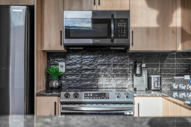 kitchen with backsplash and stainless steel appliances