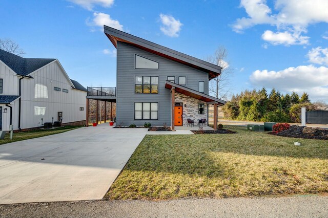 101 Retreat Ln, Huddleston, VA 24104 - contemporary house featuring central air condition unit, stone siding, a front lawn, and concrete driveway