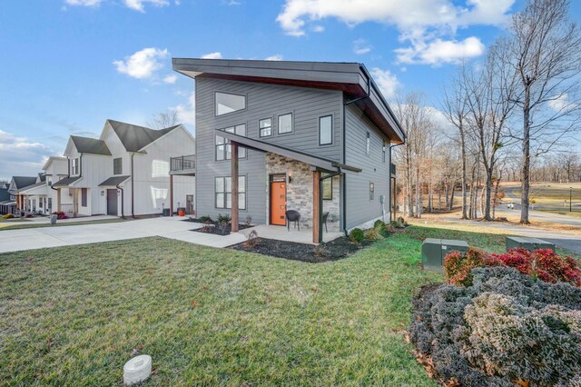 101 Retreat Ln, Huddleston, VA 24104 - rear view of property with stone siding and a lawn