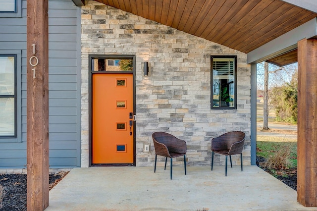 entrance to property with stone siding