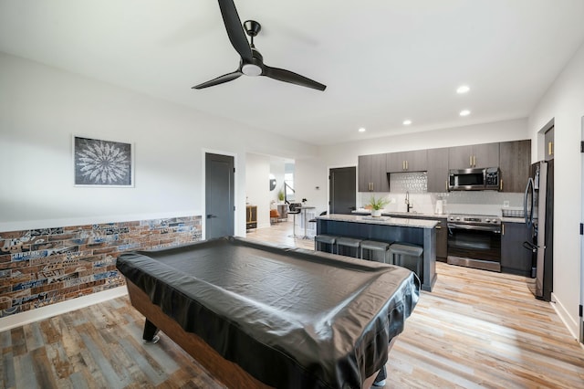 recreation room with a sink, billiards, light wood-type flooring, ceiling fan, and recessed lighting