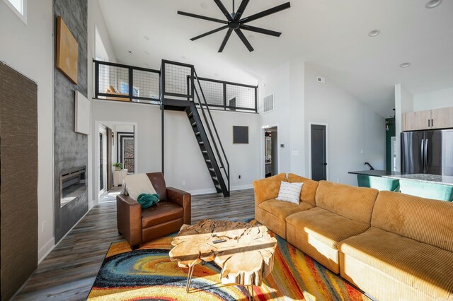 101 Retreat Ln, Huddleston, VA 24104 - living room with high vaulted ceiling, a ceiling fan, wood finished floors, and visible vents