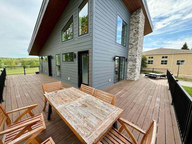 deck featuring outdoor dining area