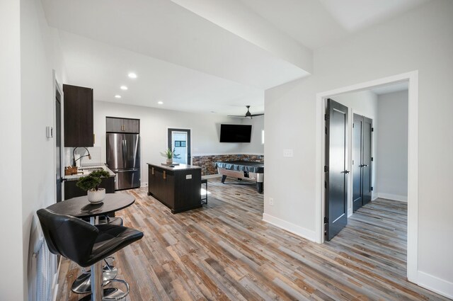 101 Retreat Ln, Huddleston, VA 24104 - kitchen featuring a ceiling fan, stainless steel refrigerator, light wood-style floors, a center island, and baseboards