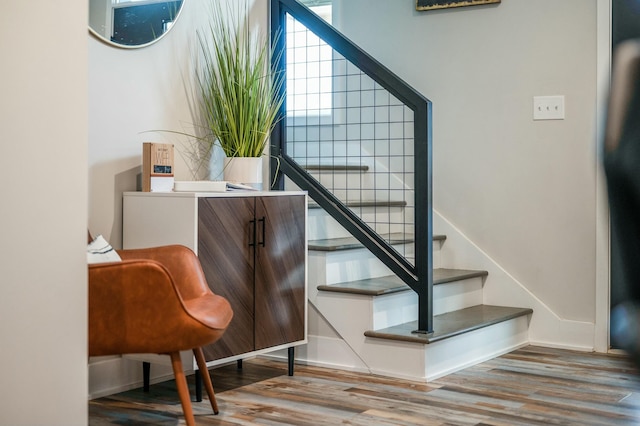 stairs with wood finished floors