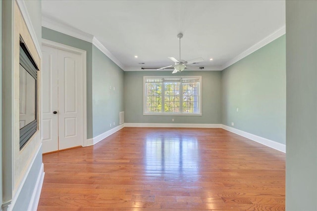 unfurnished living room featuring light wood-style floors, recessed lighting, ornamental molding, and baseboards
