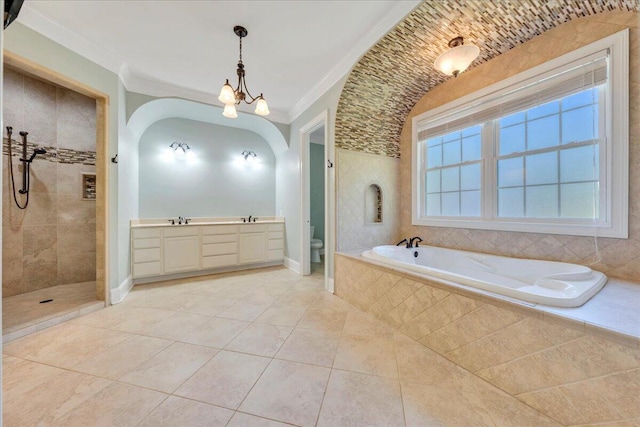 bathroom featuring a sink, walk in shower, tile patterned floors, toilet, and a garden tub