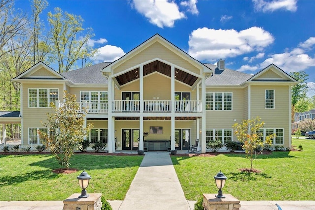 exterior space featuring a front lawn, roof with shingles, french doors, and a chimney