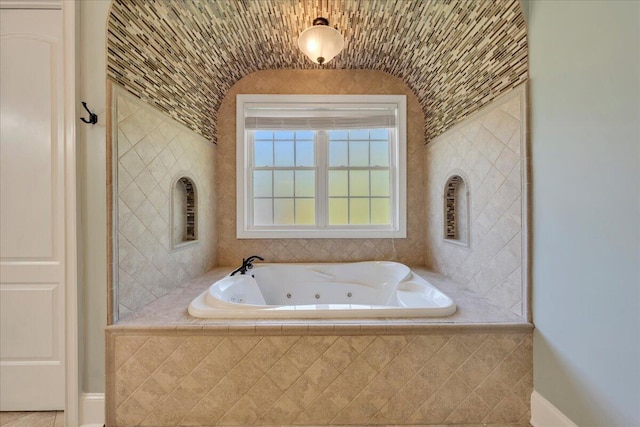 full bath with a whirlpool tub
