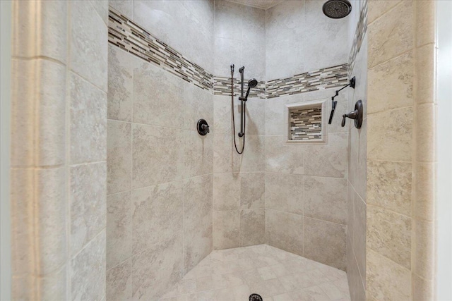 bathroom featuring tiled shower