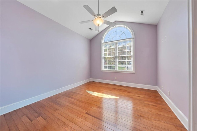 unfurnished room featuring visible vents, ceiling fan, light wood-style flooring, and vaulted ceiling
