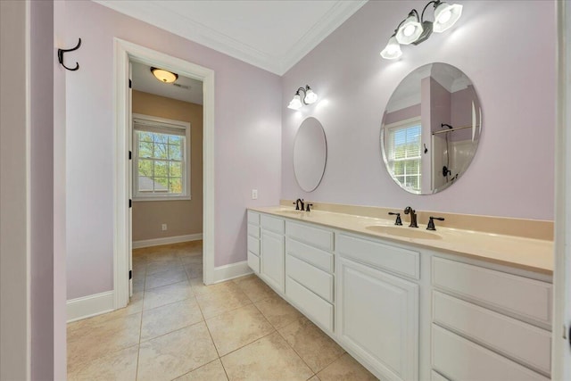 full bath with baseboards, tile patterned flooring, double vanity, and a sink