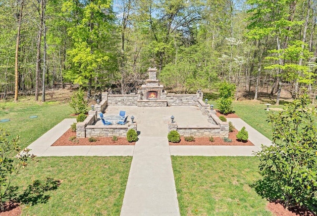 exterior space featuring a patio and an outdoor stone fireplace