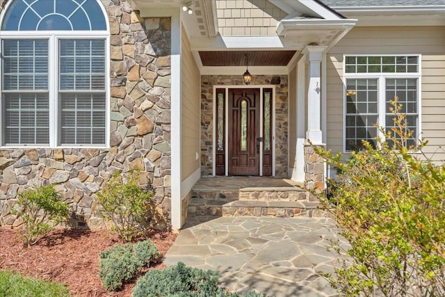 entrance to property with stone siding