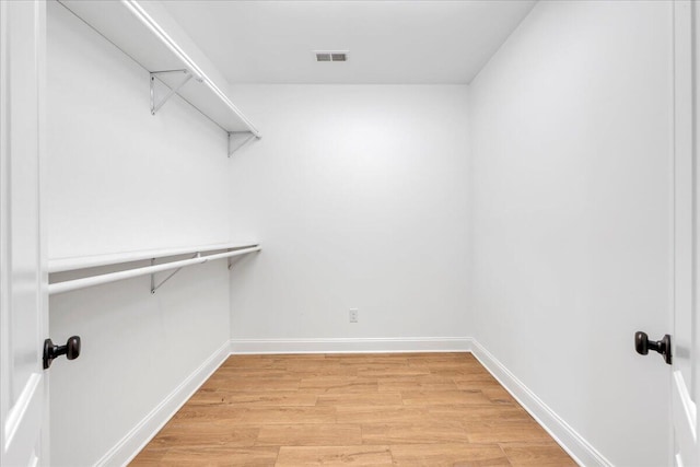 walk in closet with visible vents and light wood-style flooring