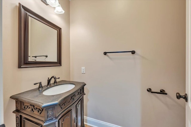 bathroom featuring vanity and baseboards