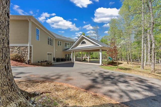 exterior space featuring a carport and driveway