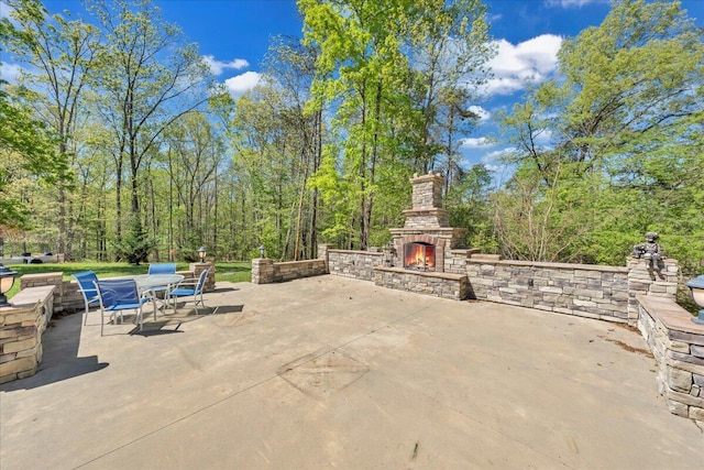view of patio / terrace with an outdoor stone fireplace