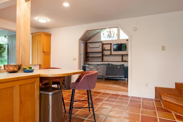 dining room with recessed lighting and an inviting chandelier