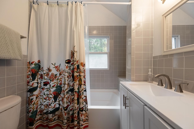 bathroom featuring tile walls, shower / bath combo with shower curtain, backsplash, toilet, and vanity