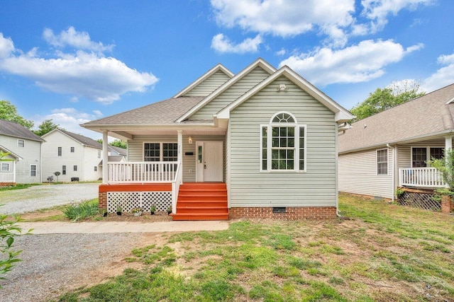 bungalow-style home with covered porch and crawl space