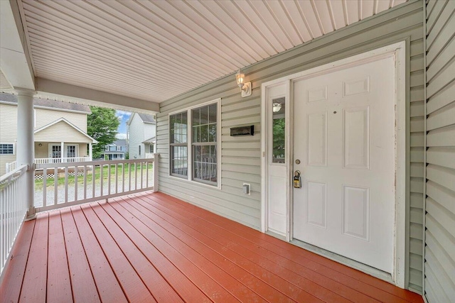 wooden deck featuring covered porch
