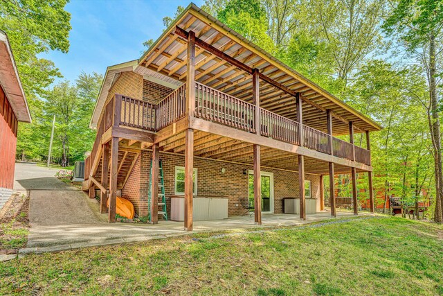 14 Kamp Branch Rd, Union Hall, VA 24176 - ranch-style house featuring a chimney, brick siding, an outdoor structure, a front lawn, and a storage unit