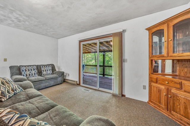 carpeted living area with a textured ceiling, visible vents, a baseboard heating unit, and baseboards