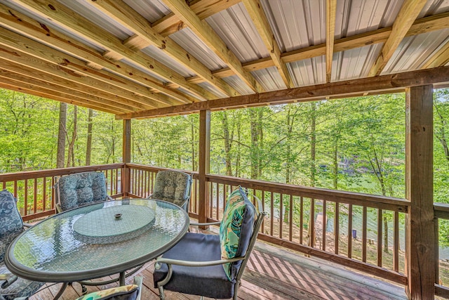 sunroom / solarium with outdoor dining space