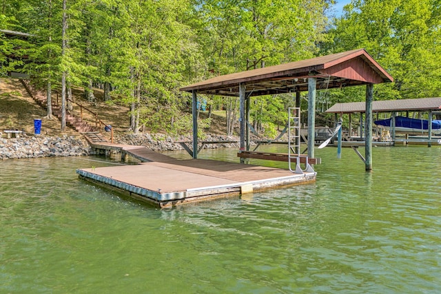 view of dock featuring boat lift and a water view