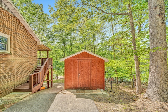 view of shed with stairs