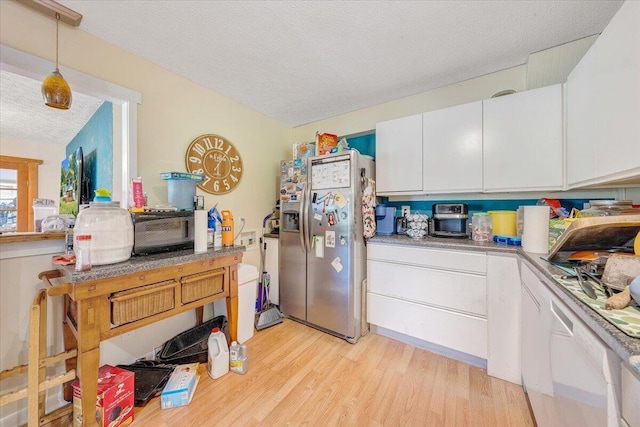 712 Baltimore Ave, Bedford, VA 24523 - kitchen with stainless steel fridge, a textured ceiling, white cabinetry, light wood-style flooring, and pendant lighting