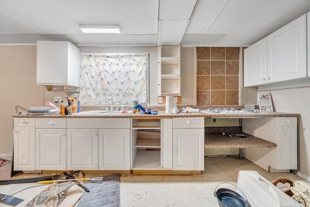 712 Baltimore Ave, Bedford, VA 24523 - kitchen featuring a sink, open shelves, white cabinets, and light countertops