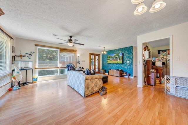712 Baltimore Ave, Bedford, VA 24523 - living area with wood finished floors, ceiling fan, a textured ceiling, and a chandelier