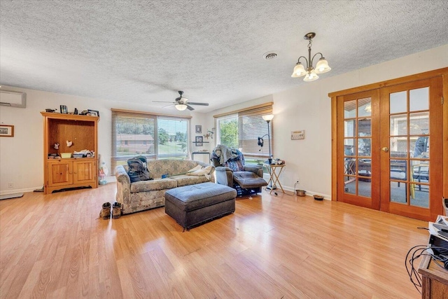 712 Baltimore Ave, Bedford, VA 24523 - living room with wood finished floors, french doors, a textured ceiling, a chandelier, and baseboards