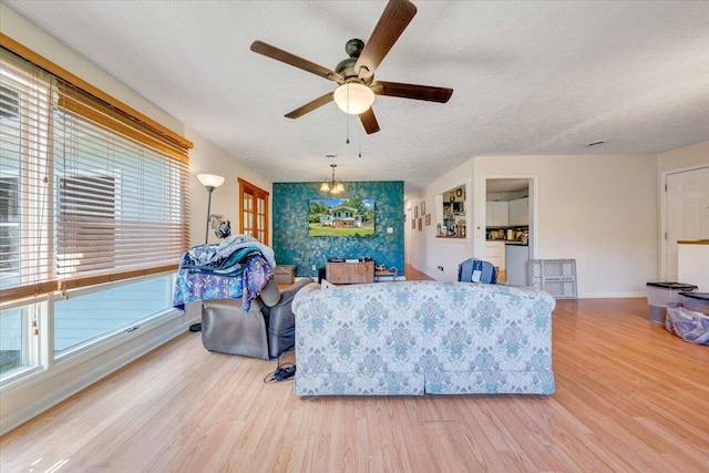 712 Baltimore Ave, Bedford, VA 24523 - living area with a textured ceiling, ceiling fan, wood finished floors, and baseboards