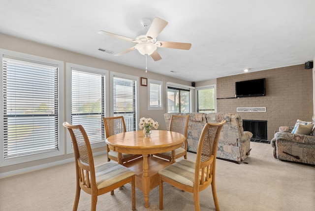 75 Dockside Cir Unit 308, Moneta, VA 24121 - dining space with a fireplace, a ceiling fan, light colored carpet, and visible vents