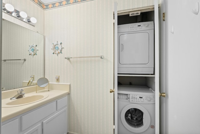 75 Dockside Cir Unit 308, Moneta, VA 24121 - bathroom with wallpapered walls, stacked washer / dryer, and vanity
