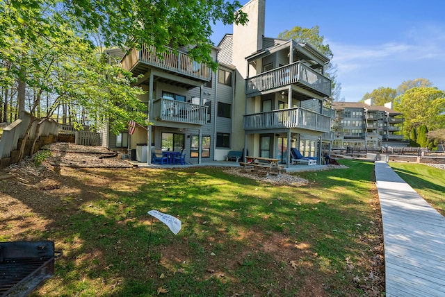 75 Dockside Cir Unit 308, Moneta, VA 24121 - back of house featuring a lawn, fence, and a patio area