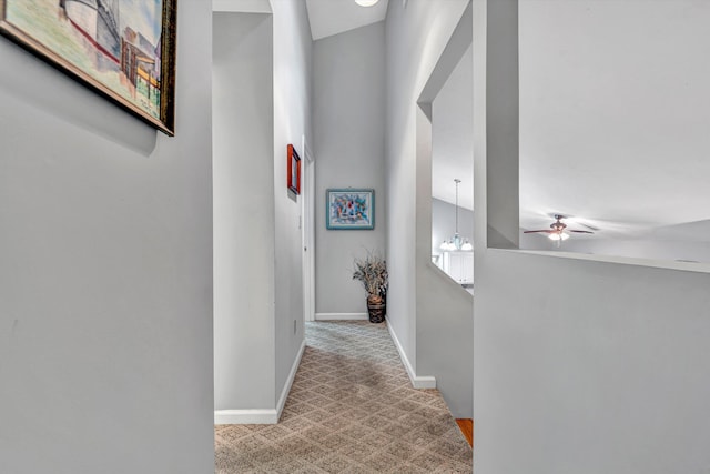 hallway featuring baseboards