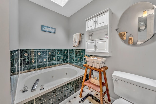 full bath with a jetted tub, a skylight, and toilet