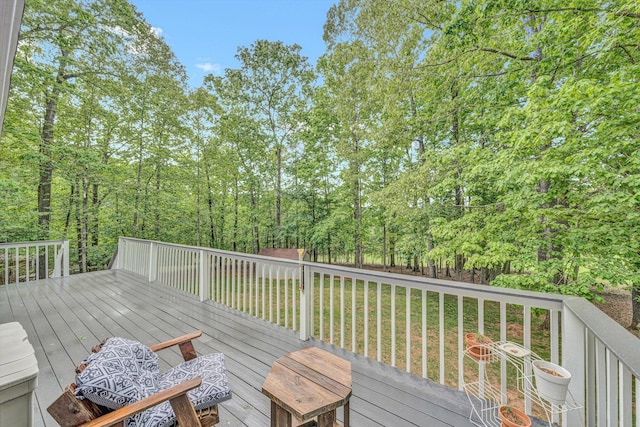 wooden deck with a yard