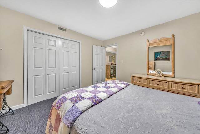 carpeted bedroom with visible vents and a closet