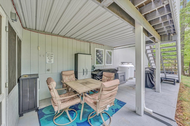 view of patio / terrace featuring outdoor dining area and stairs