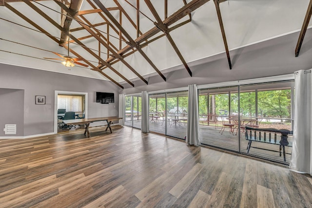 living area featuring baseboards, high vaulted ceiling, ceiling fan, and wood finished floors