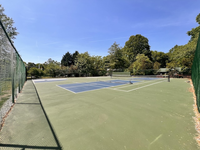 view of sport court featuring fence and community basketball court