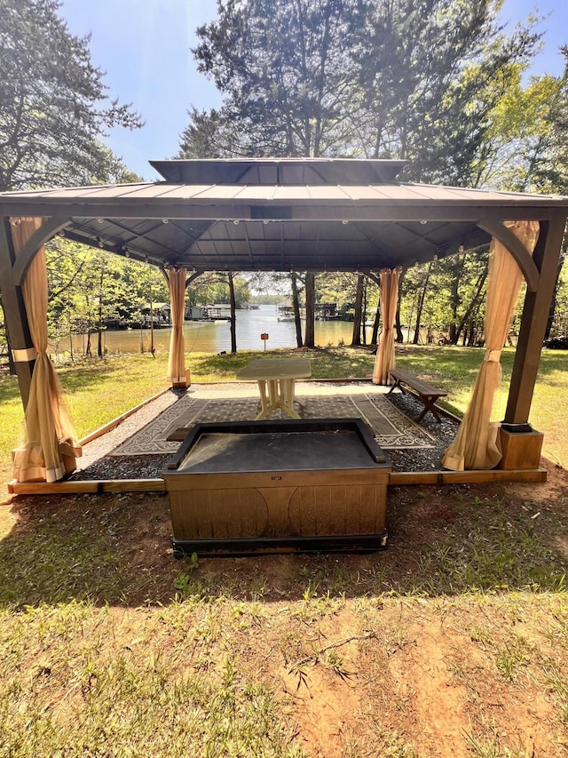 exterior space featuring a water view and a gazebo