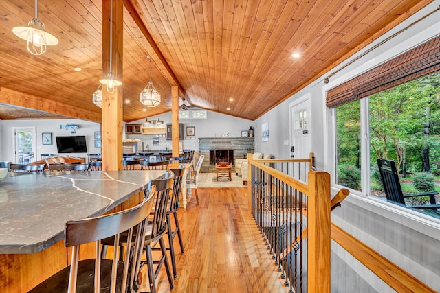 511 Autumn Ave, Huddleston, VA 24104 - dining area featuring wooden ceiling, light wood finished floors, and a stone fireplace