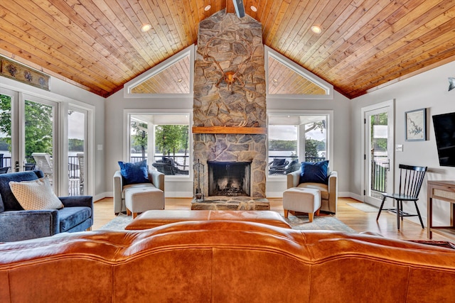 511 Autumn Ave, Huddleston, VA 24104 - living room featuring wood ceiling, a stone fireplace, light wood-style floors, baseboards, and high vaulted ceiling